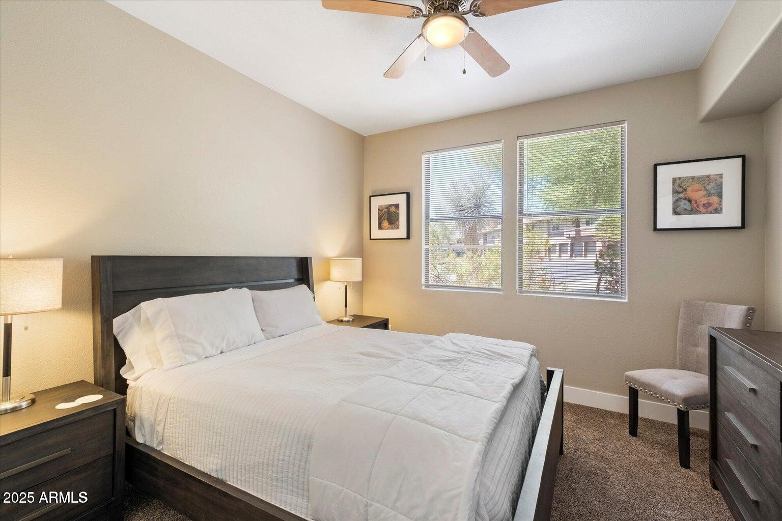 19777 North 76th Street, Unit 1229 Scottsdale, AZ 85255 - Photo 13 of 25 a bedroom with a bed and a window