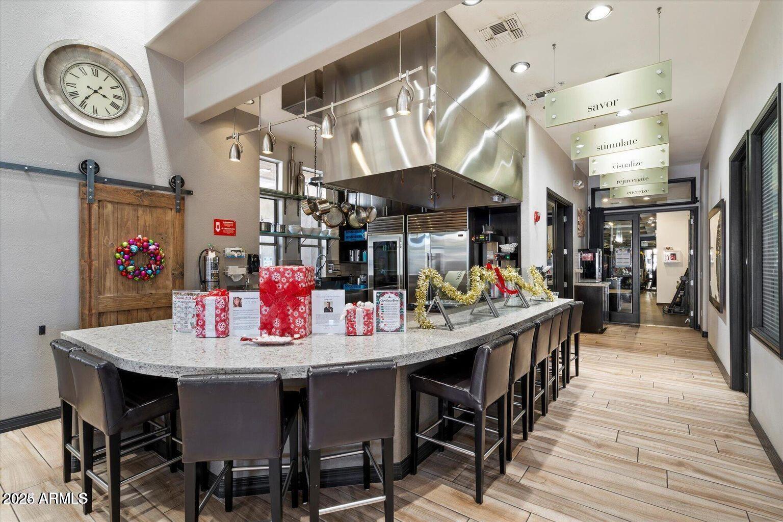 19777 North 76th Street, Unit 1229 Scottsdale, AZ 85255 - Photo 18 of 25 a dining area with stainless steel appliances kitchen island a table and chairs