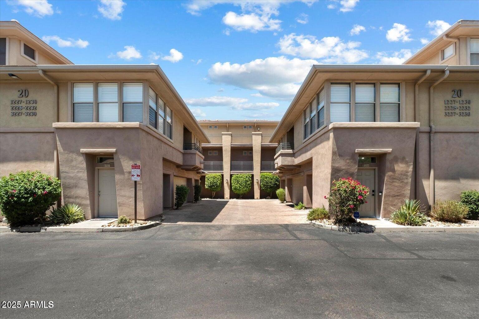 19777 North 76th Street, Unit 1229 Scottsdale, AZ 85255 - Photo 2 of 25 a view of a building with a street
