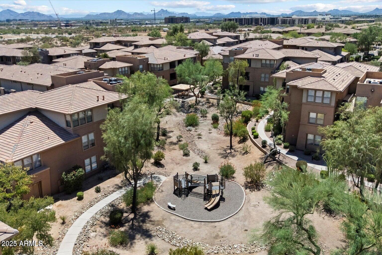 19777 North 76th Street, Unit 1229 Scottsdale, AZ 85255 - Photo 21 of 25 an aerial view of a house with a yard