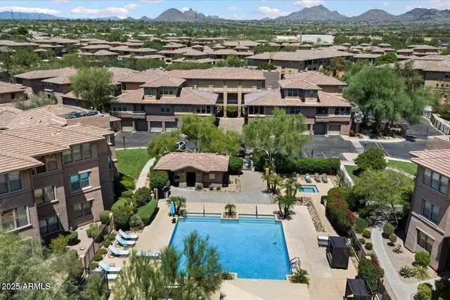 an aerial view of residential houses and outdoor space