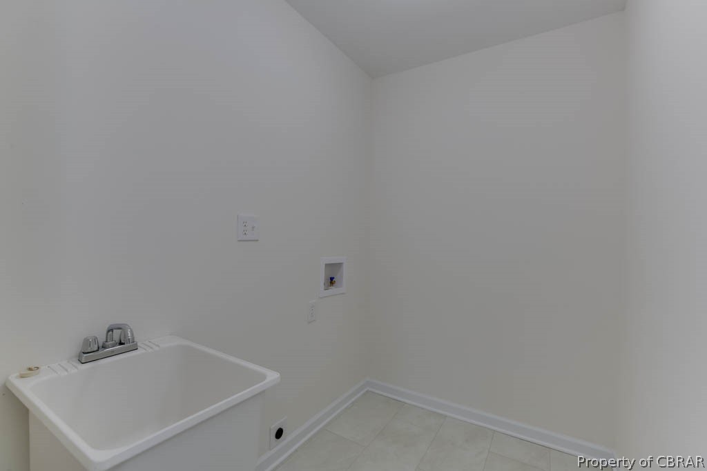 400 Showalter Road Yorktown, VA 23692 - Photo 24 of 49 Laundry area featuring sink, hookup for an electric dryer, hookup for a washing machine, and light tile patterned floors