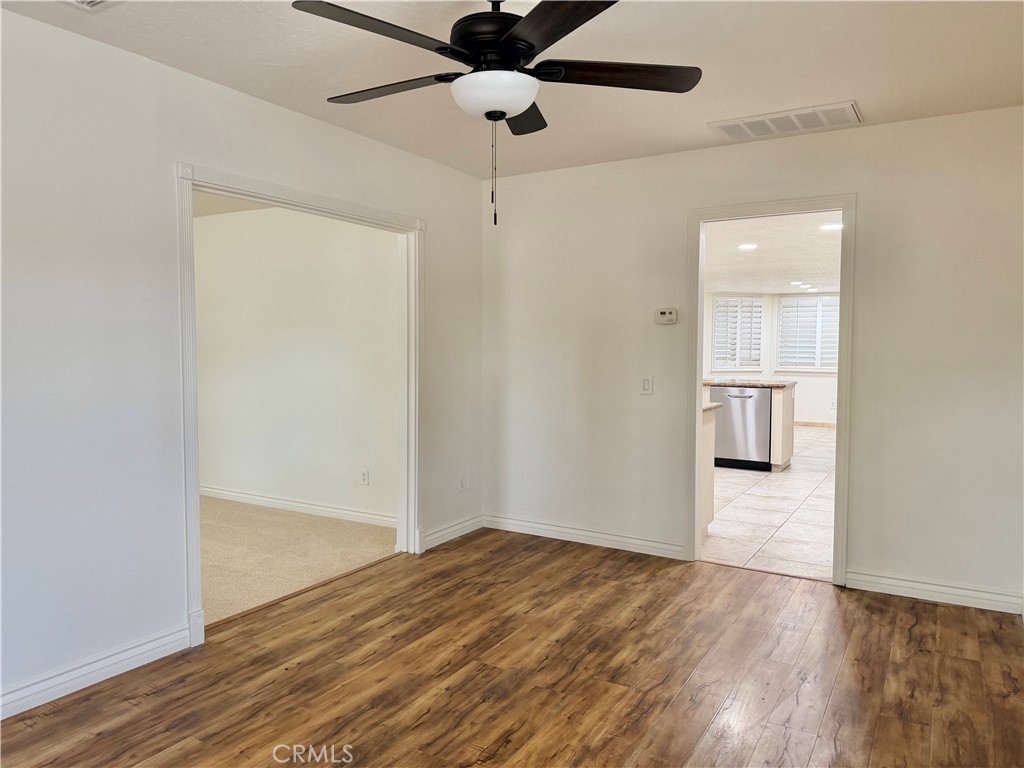 14840 Pamlico Road Apple Valley, CA 92307 - Photo 18 of 38 a view of empty room with wooden floor