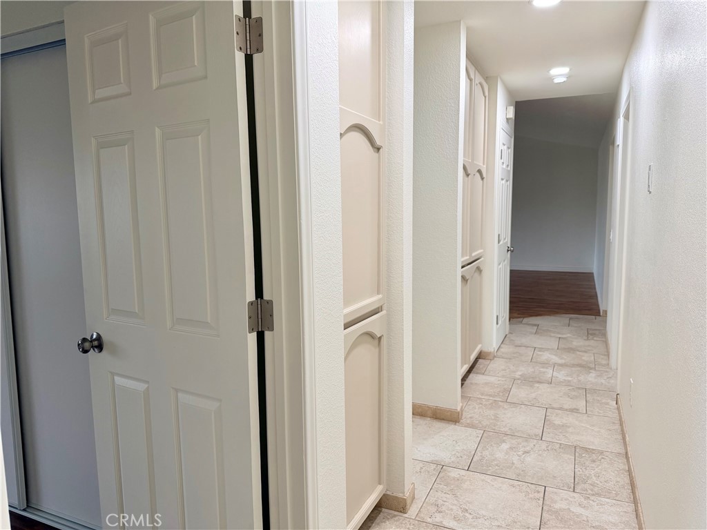 14840 Pamlico Road Apple Valley, CA 92307 - Photo 24 of 39 a bathroom with a glass shower door