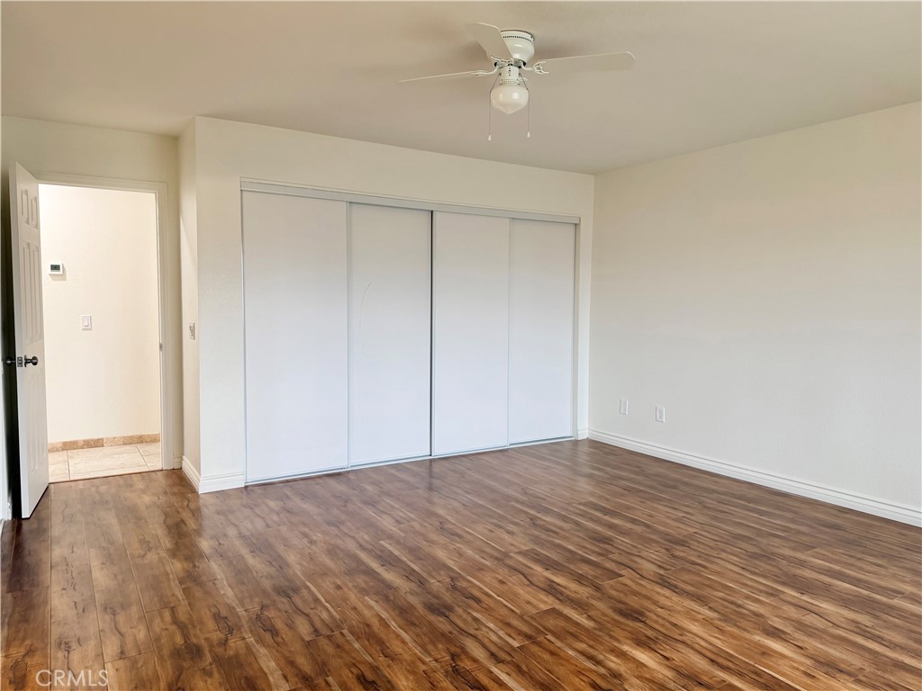 14840 Pamlico Road Apple Valley, CA 92307 - Photo 30 of 39 a view of empty room with wooden floor