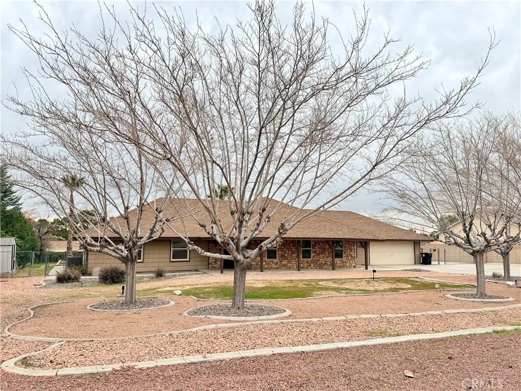 14840 Pamlico Road Apple Valley, CA 92307 - Photo 5 of 39 a front view of a house with a yard