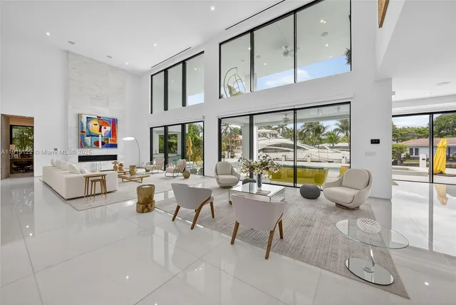 a large white kitchen with a large window