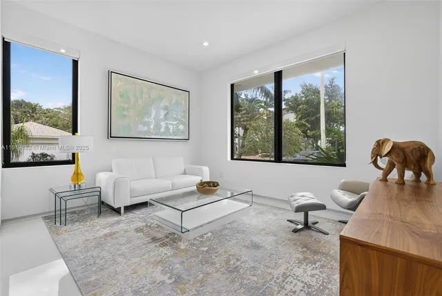 a bathroom with a shower sink and mirror