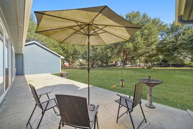 a table and chairs in the garden