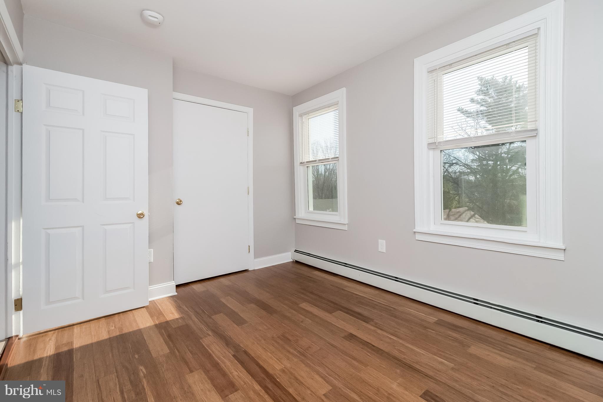 17 A State Road, Unit A Media, PA 19063 - Photo 15 of 19 an empty room with wooden floor and windows