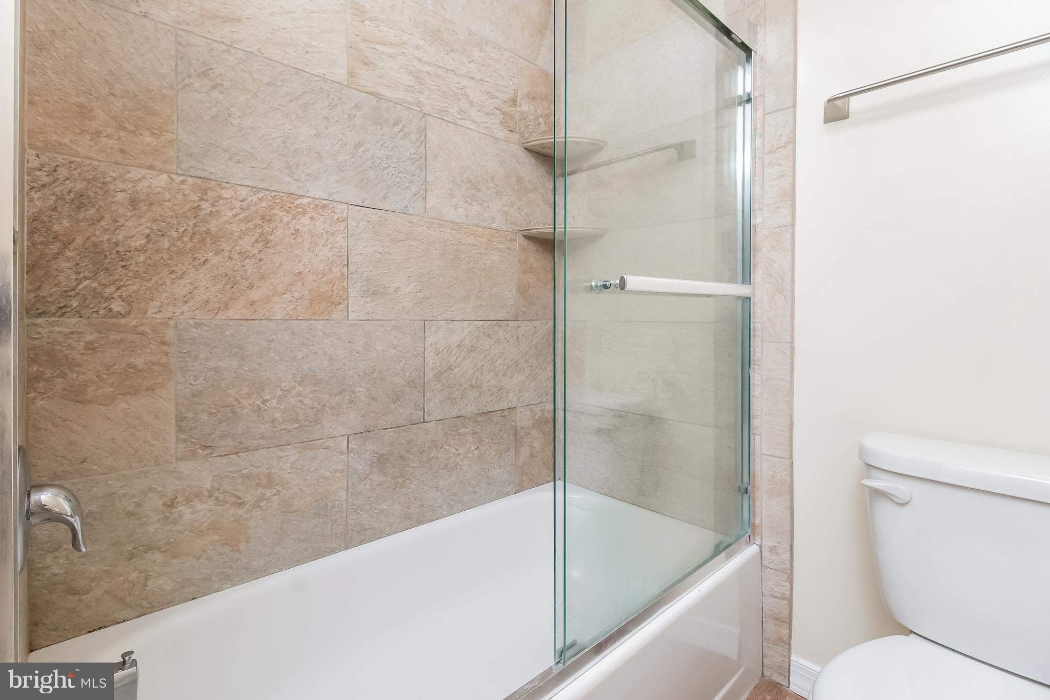 17 A State Road, Unit A Media, PA 19063 - Photo 18 of 19 a bathroom with a bathtub and a toilet