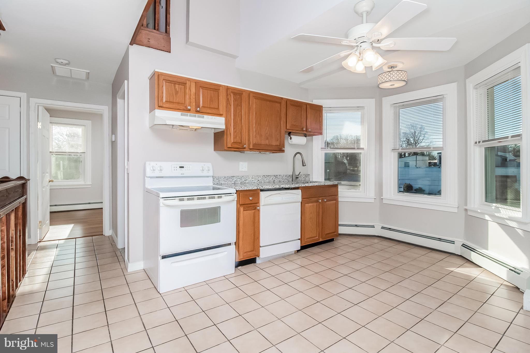 17 A State Road, Unit A Media, PA 19063 - Photo 3 of 19 a kitchen with a stove a sink and a refrigerator