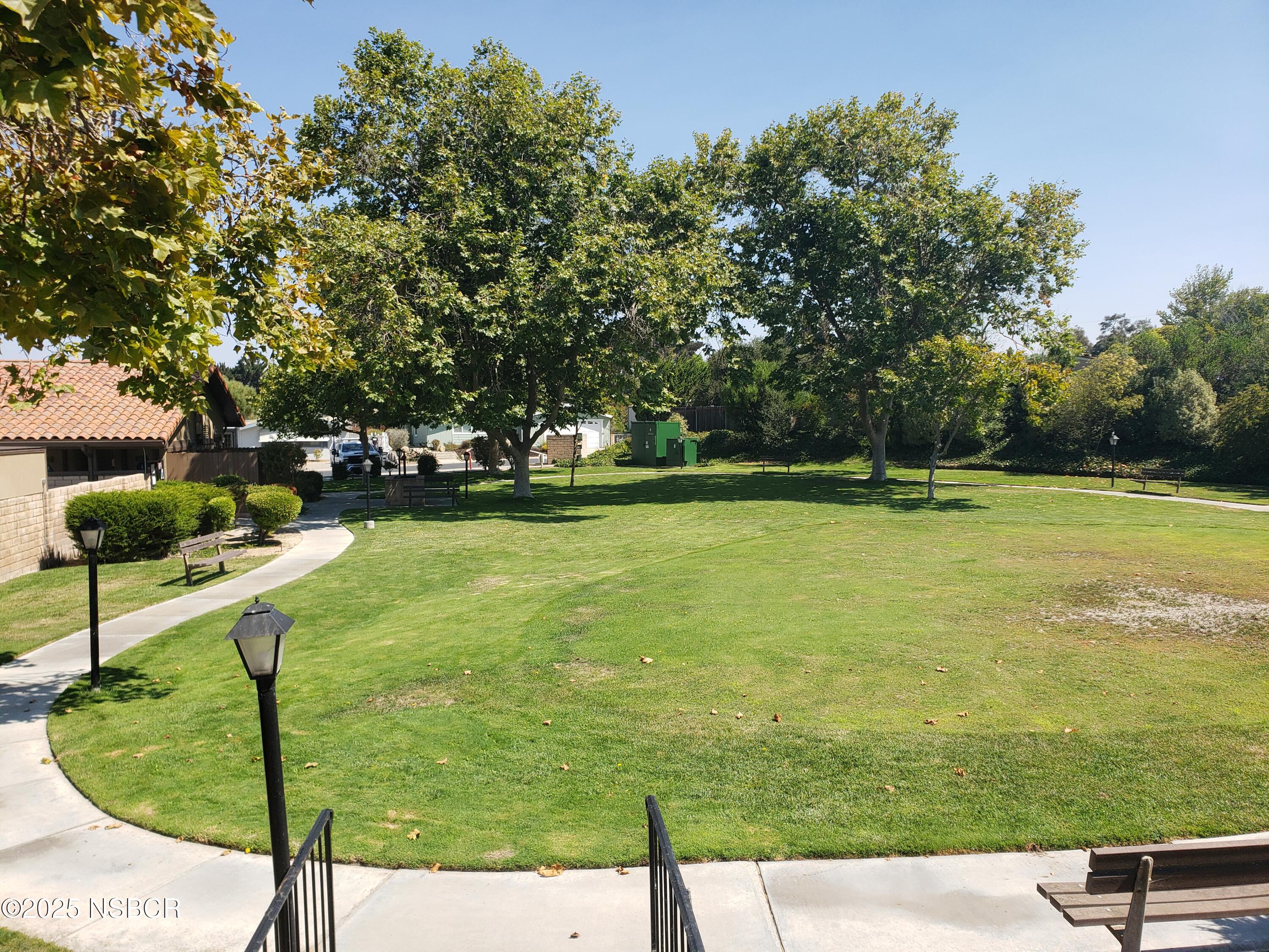 3822 Cherry Hill Road Santa Maria, CA 93455 - Photo 6 of 22 a view of a swimming pool and a yard