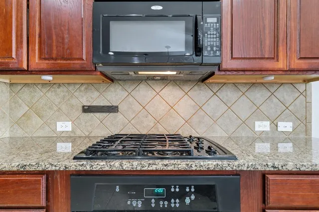 a stove top oven sitting inside of a kitchen