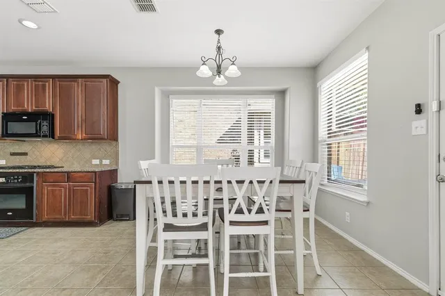 a kitchen with granite countertop furniture and window