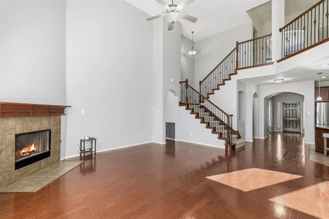 a view of entryway and hall with a fireplace