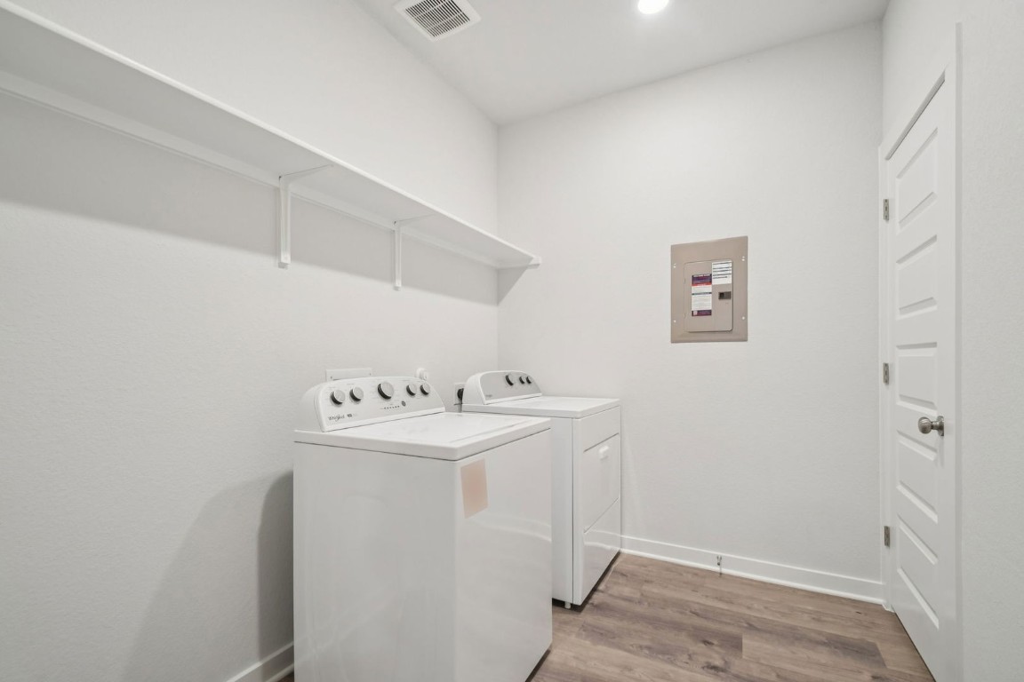 163 Two Bits Lane Elgin, TX 78621 - Photo 23 of 34 a utility room with dryer and washer