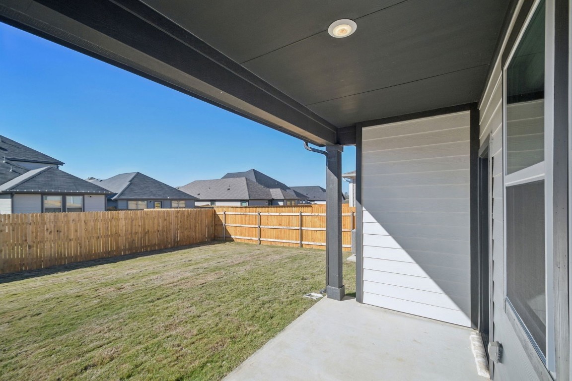 163 Two Bits Lane Elgin, TX 78621 - Photo 28 of 34 a view of a house with a yard