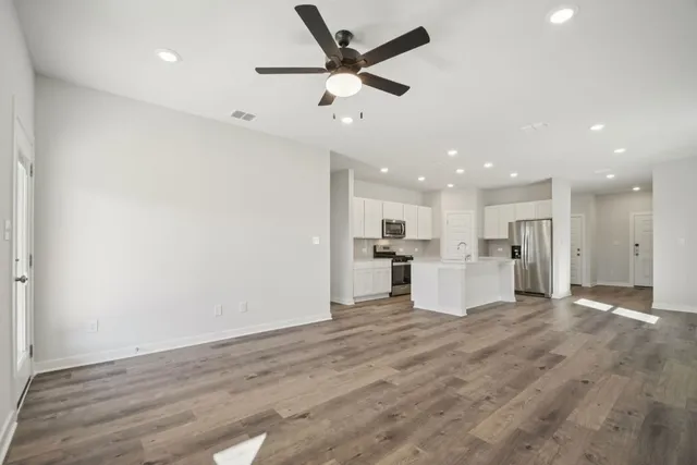 a view of kitchen with wooden floor and window