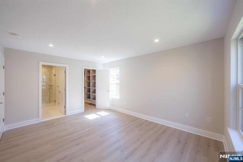 327 Penns Way Bernards, NJ 07920 - Photo 12 of 23 a view of an empty room with wooden floor