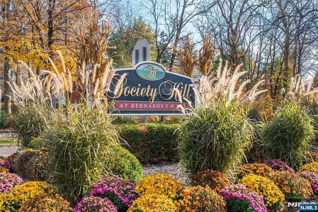 327 Penns Way Bernards, NJ 07920 - Photo 2 of 23 a view of outdoor space with sign board and trees