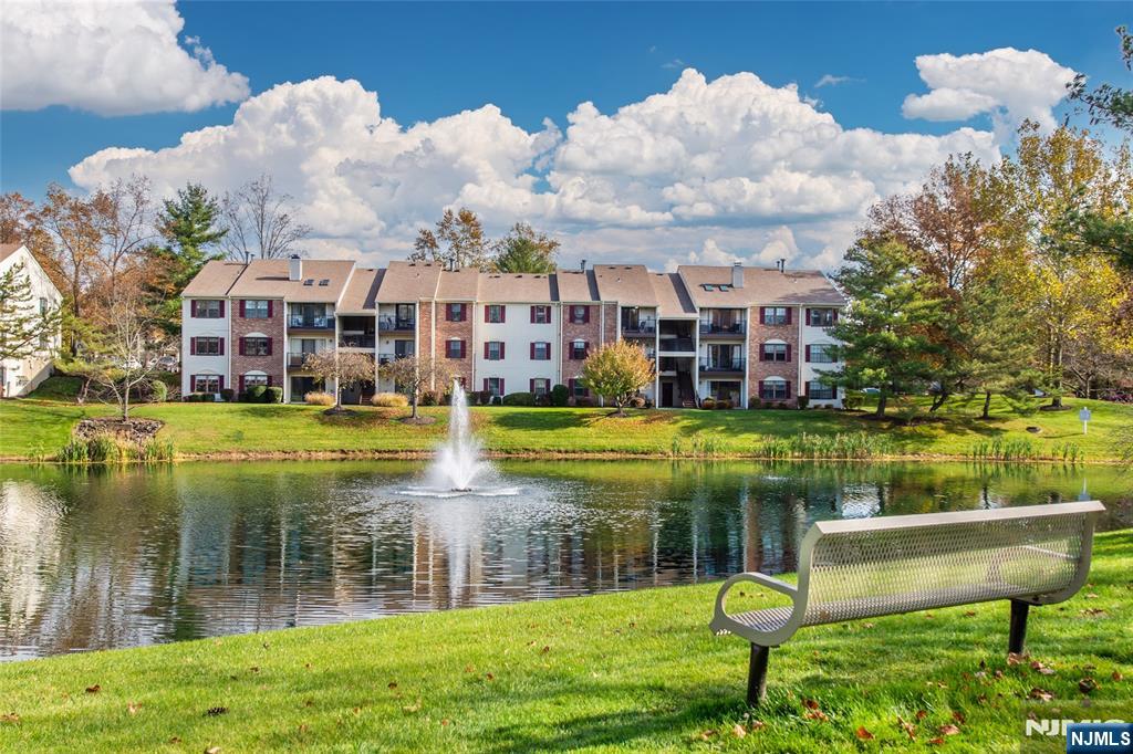 327 Penns Way Bernards, NJ 07920 - Photo 22 of 23 a view of a lake with a building in the background