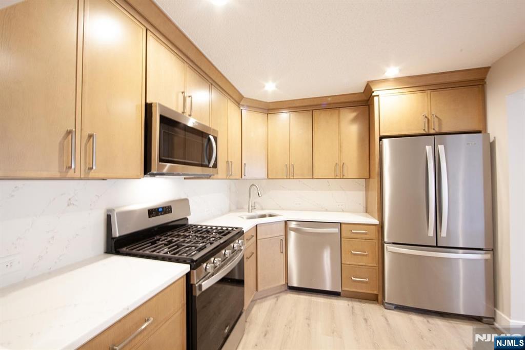 327 Penns Way Bernards, NJ 07920 - Photo 6 of 23 a kitchen with a refrigerator stove and microwave