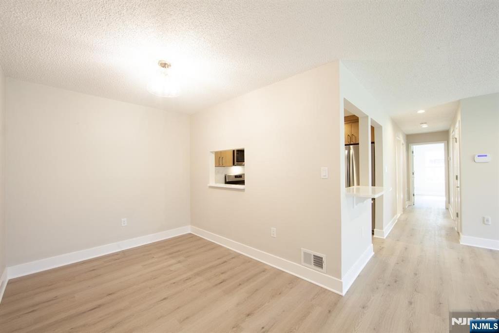327 Penns Way Bernards, NJ 07920 - Photo 8 of 23 a view of a hallway with wooden floor
