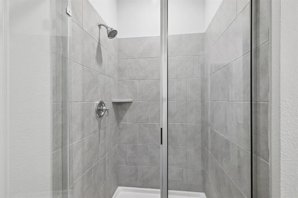 1685 Timpson Drive Forney, TX 75126 - Photo 24 of 36 a bathroom with a shower