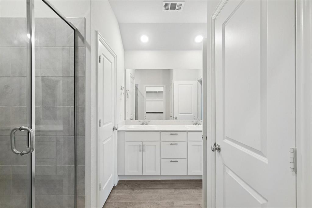 1685 Timpson Drive Forney, TX 75126 - Photo 26 of 36 a bathroom with a shower and a sink