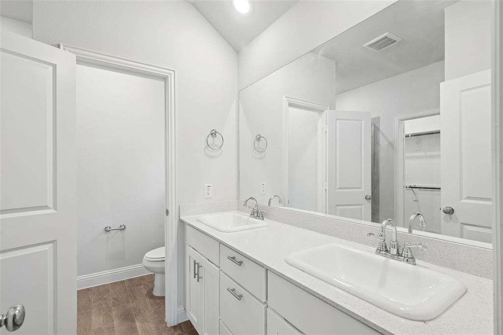 1685 Timpson Drive Forney, TX 75126 - Photo 27 of 36 a bathroom with a sink toilet and shower
