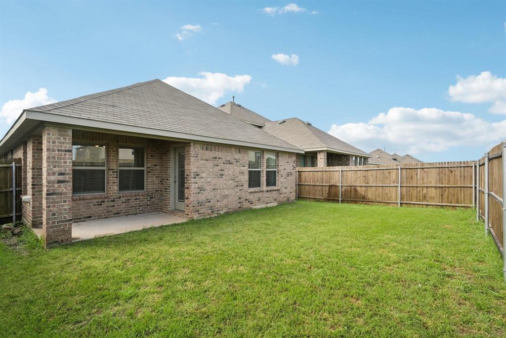 1685 Timpson Drive Forney, TX 75126 - Photo 32 of 36 a view of a house with a backyard