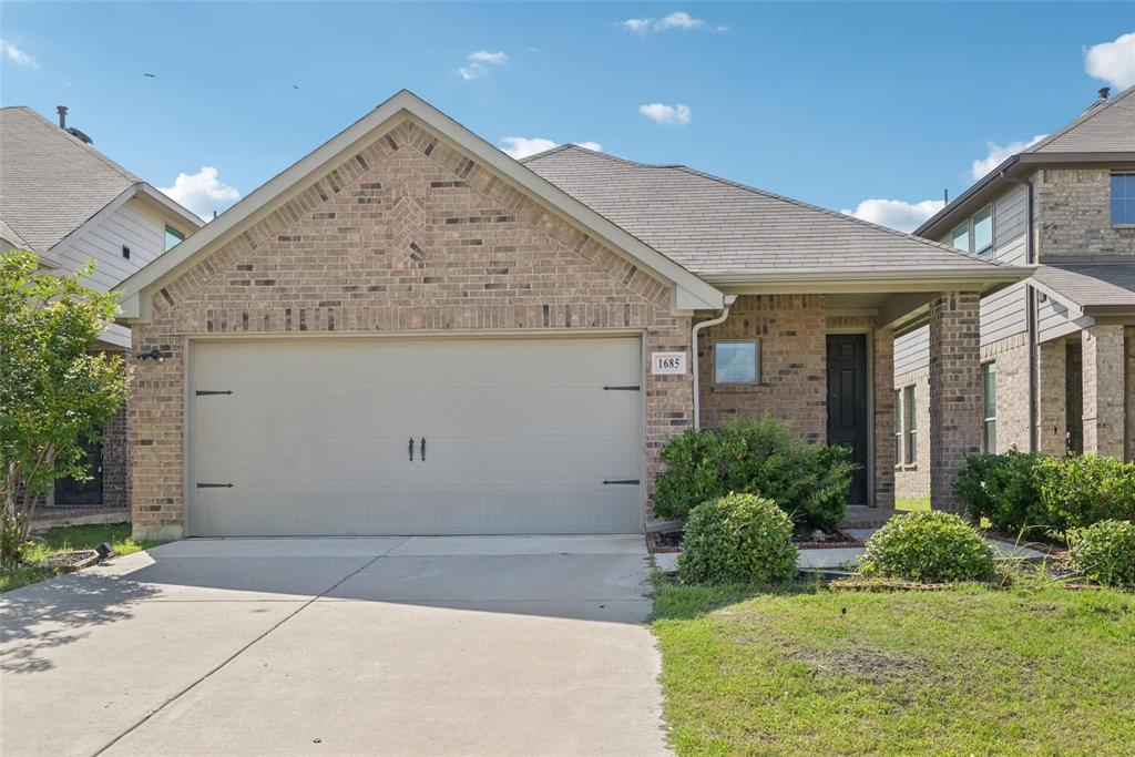 1685 Timpson Drive Forney, TX 75126 - Photo 35 of 36 a view of a white house next to a yard
