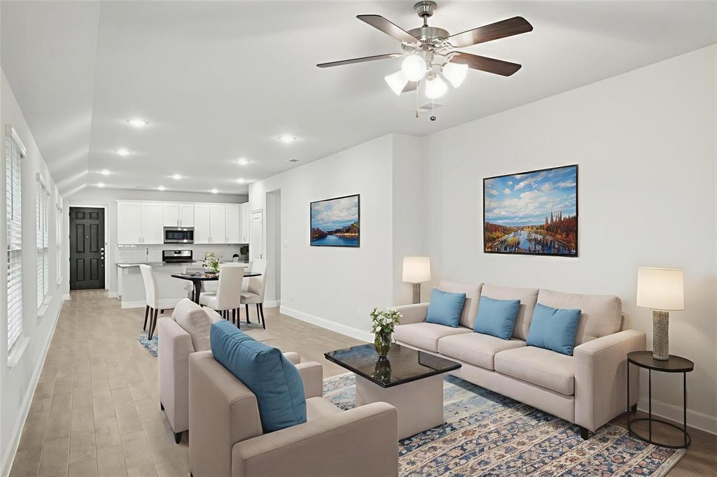 1685 Timpson Drive Forney, TX 75126 - Photo 5 of 36 a living room with furniture kitchen view and a chandelier