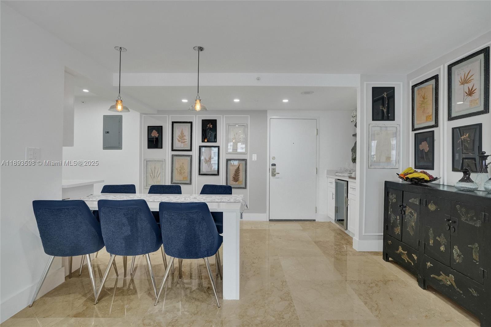 5225 Collins Avenue, Unit 1411 Miami Beach, FL 33140 - Photo 12 of 34 a view of kitchen and dining area with furniture