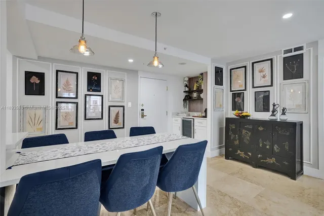 a living room with furniture a rug a table and a large window