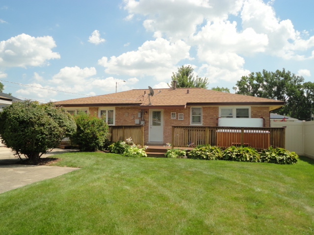 10338 Barnard Drive Chicago Ridge, IL 60415 - Photo 11 of 17 a front view of a house with a yard