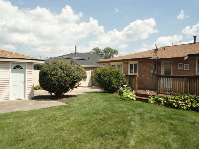 10338 Barnard Drive Chicago Ridge, IL 60415 - Photo 12 of 17 a front view of a house with garden
