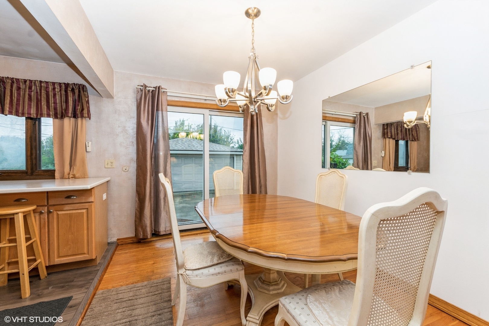 10338 Barnard Drive Chicago Ridge, IL 60415 - Photo 3 of 17 a view of a dining room with furniture and a chandelier