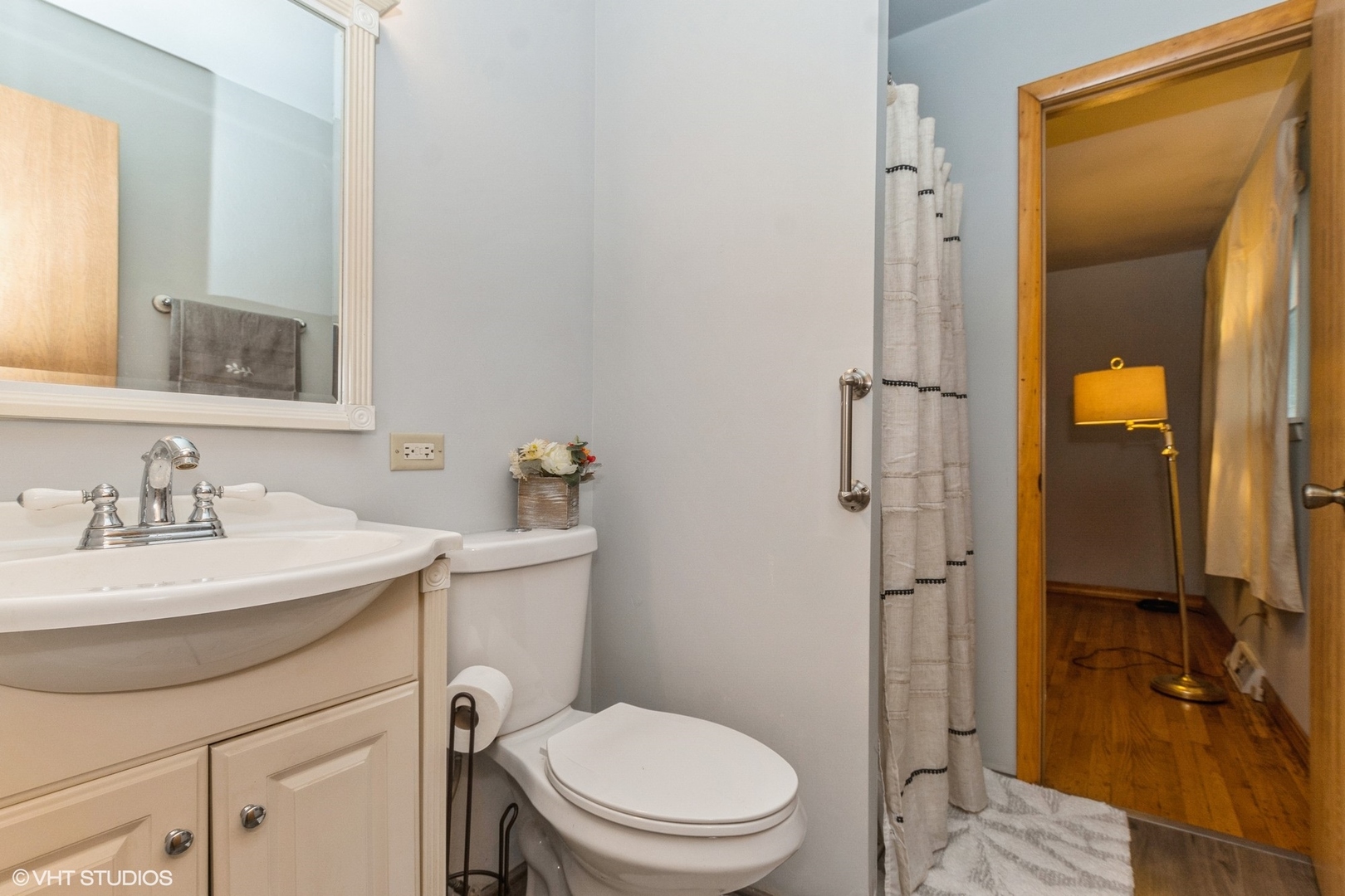 10338 Barnard Drive Chicago Ridge, IL 60415 - Photo 7 of 17 a bathroom with a sink toilet vanity and shower