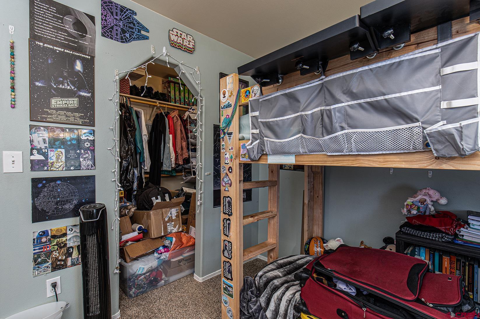 1100 Goeglein Gulch Road, Unit 170 Durango, CO 81301 - Photo 15 of 21 a view of walk in closet with clothes and shoes