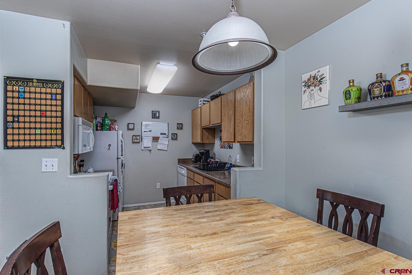 1100 Goeglein Gulch Road, Unit 170 Durango, CO 81301 - Photo 5 of 21 a bedroom with a bed and a chandelier