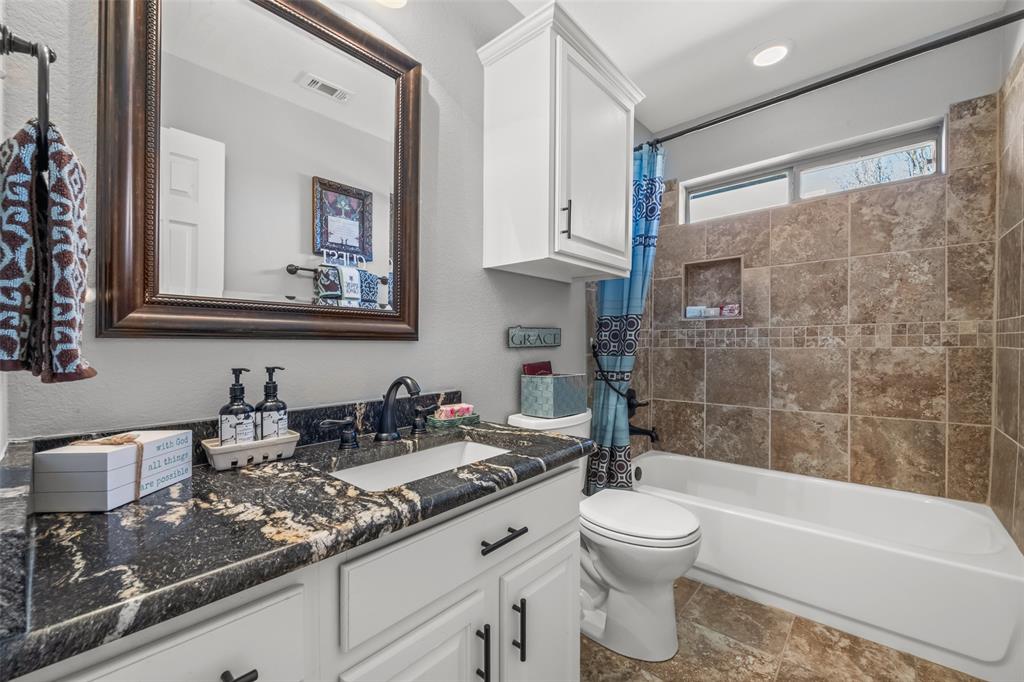 11277 Emerald Ranch Lane Forney, TX 75126 - Photo 20 of 32 a bathroom with a double vanity sink toilet and shower