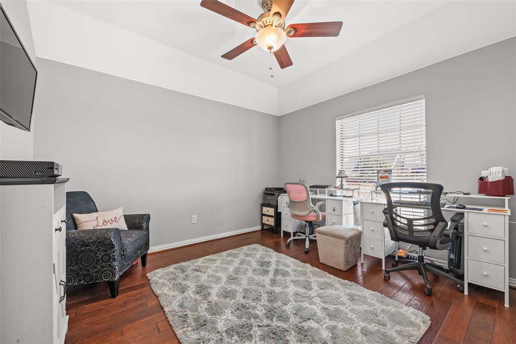 11277 Emerald Ranch Lane Forney, TX 75126 - Photo 21 of 32 a workspace with wooden floor and a window
