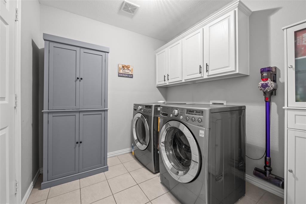 11277 Emerald Ranch Lane Forney, TX 75126 - Photo 22 of 32 a utility room with dryer and washer