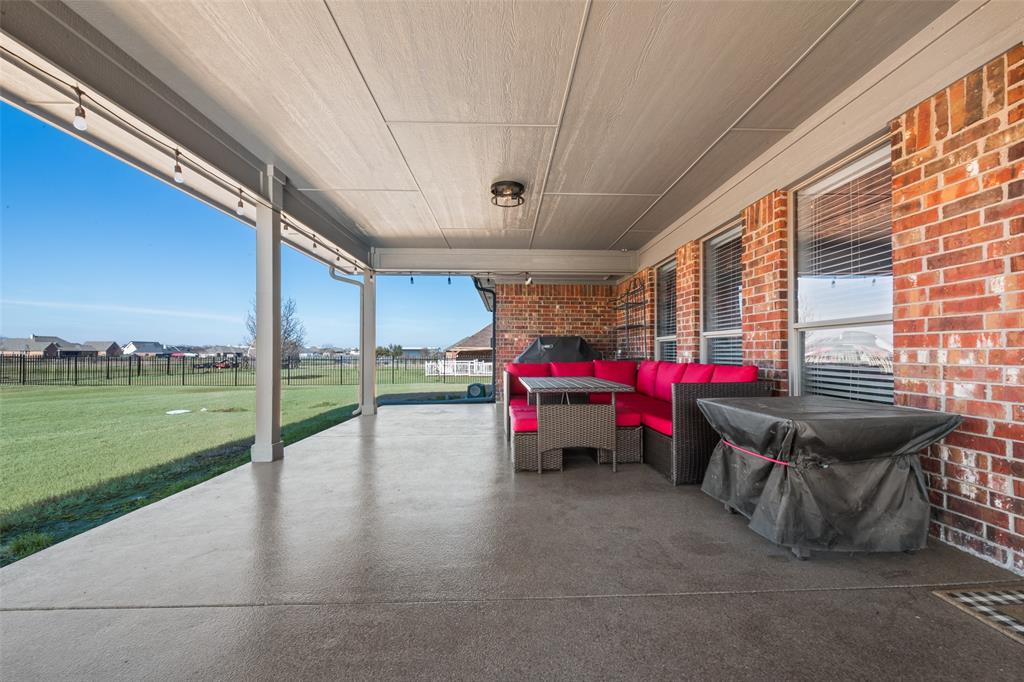 11277 Emerald Ranch Lane Forney, TX 75126 - Photo 23 of 32 a view of a play room with furniture and garden