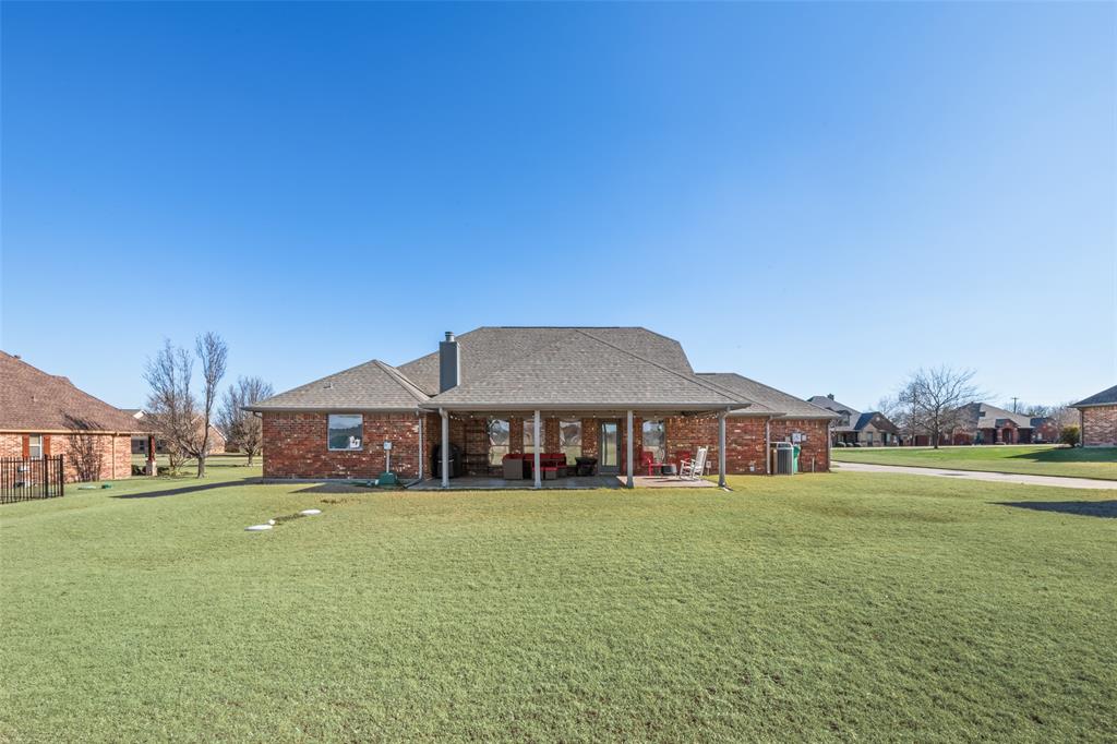11277 Emerald Ranch Lane Forney, TX 75126 - Photo 25 of 32 a front view of a building with garden