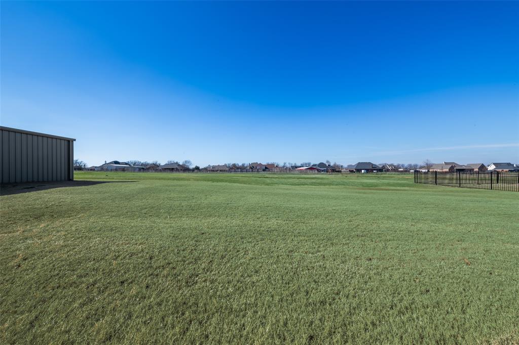 11277 Emerald Ranch Lane Forney, TX 75126 - Photo 27 of 32 a view of a field with an ocean