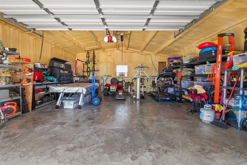 11277 Emerald Ranch Lane Forney, TX 75126 - Photo 29 of 32 a view of a garage with a lot of stuff