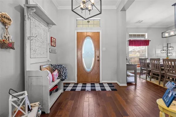 an entryway with wooden floor